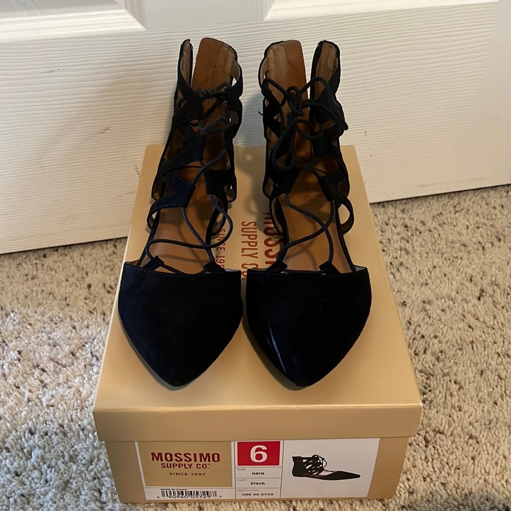 Black lace up, pointy toe flats.